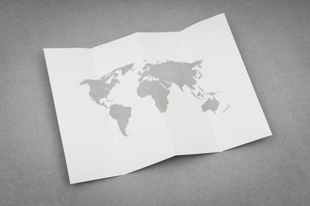 Paper folded with world map