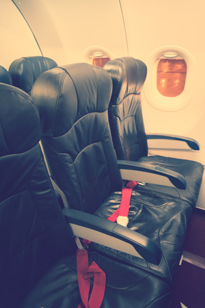 Airplane seats in the cabin ( Filtered image processed vintage effect. )の写真素材