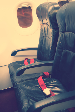 Airplane seats in the cabin ( Filtered image processed vintage effect. )の写真素材