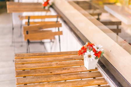 Tables and chairs in restaurantの写真素材