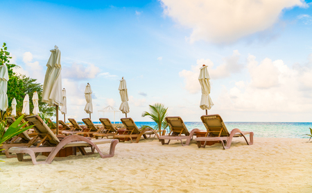 Beautiful water villas in tropical Maldives island at the sunrise timeの写真素材