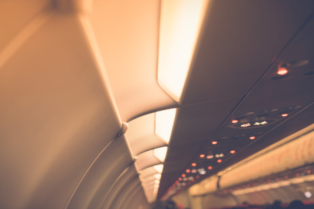 Signs panel above the seat on plane ( Filtered image processed vintage effect. )の写真素材