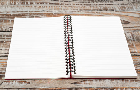 Blank notebook mock up on wood background