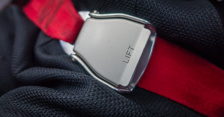 Close up of safety seat belt in the airplaneの写真素材