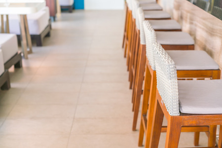 Tables and chairs in restaurantの写真素材