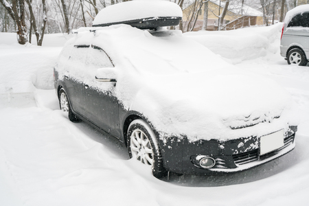 Cars covered with white snow in winterの写真素材
