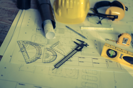 Construction plans with helmet and drawing tools on blueprints  ( Filtered image processed vintage effect. )の写真素材
