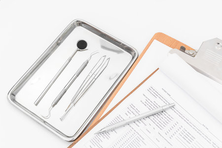 Dental tools, equipment and dental chart on white background.の写真素材