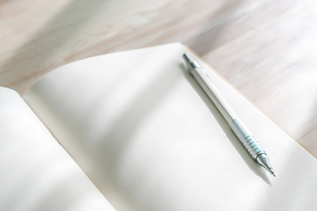 Blank catalog, magazines,book mock up with pen on wood background.の写真素材