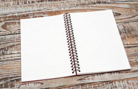 Blank notebook mock up on wood background