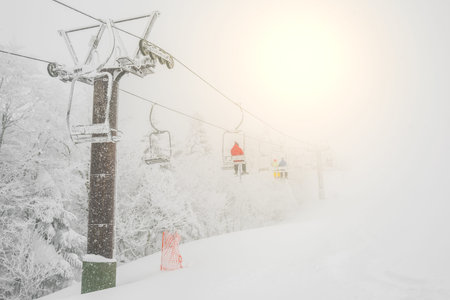 Ski lift over snow mountain in ski resortの写真素材