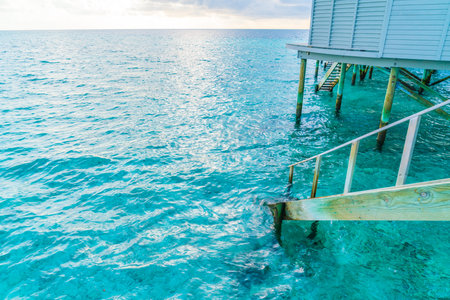 Wood stair into the sea of tropical Maldives islandの写真素材