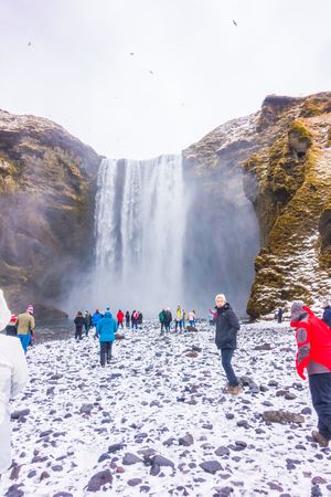 ICELAND - MARCH 15, 2017: Unidentified people at Beautiful famous waterfall in Iceland, winter seasonのeditorial素材