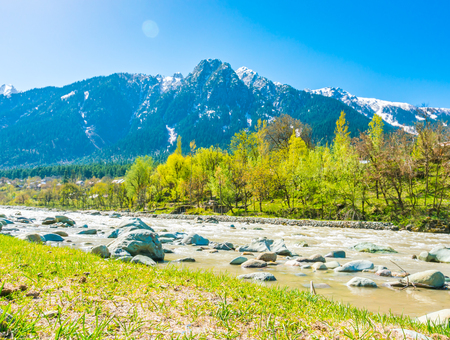 Beautiful  River and snow covered mountains landscape Kashmir state, Indiaの写真素材