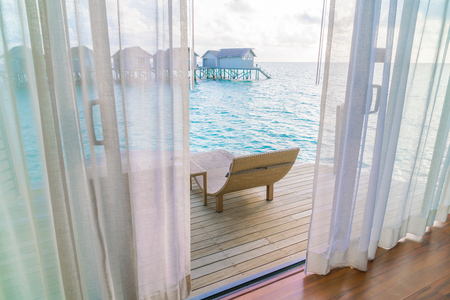 Beautiful tropical Maldives resort hotel with beach and blue waterの写真素材