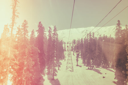 Cable car at snow mountain in Gulmark Kashmir, India ( Filtered image processed vintage effect. )