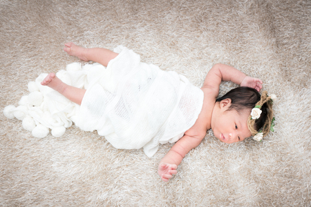 Cute newborn girl on a blanket.の写真素材
