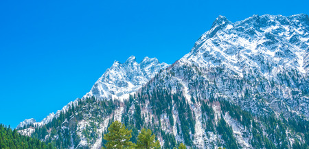 Beautiful  River and snow covered mountains landscape Kashmir state, Indiaの写真素材
