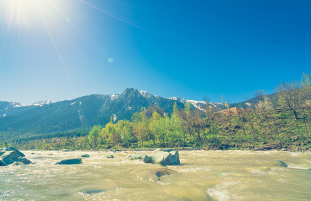 Beautiful  River and snow covered mountains landscape Kashmir state, Indiaの写真素材