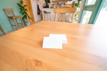 Blank business cards on wooden surface.の写真素材