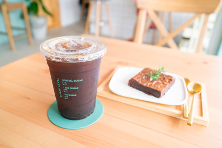 Ice coffee on wooden surface.
