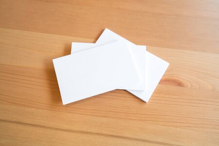 Blank business cards on wooden surface.の写真素材