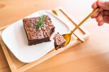Chocolate brownies on wooden surface.の写真素材