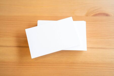 Blank business cards on wooden surface.の写真素材