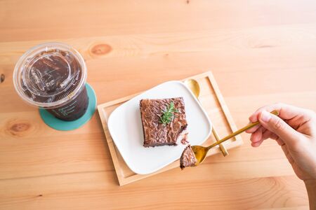 Chocolate brownies on wooden surface.の写真素材