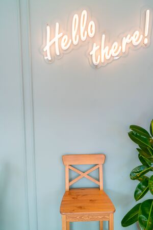 Wooden comfortable chair and green wall.の写真素材