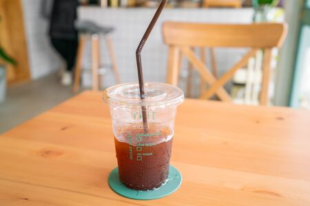 Ice americano coffee on wooden table.の写真素材