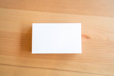 Blank business cards on wooden surface.の写真素材