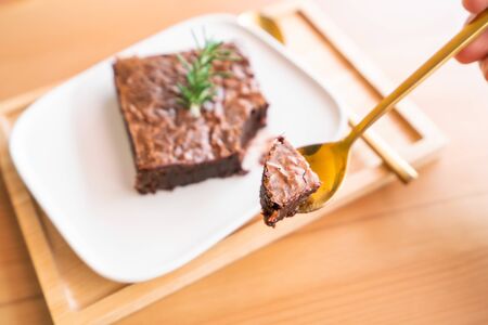 Chocolate brownies on wooden surface.の写真素材