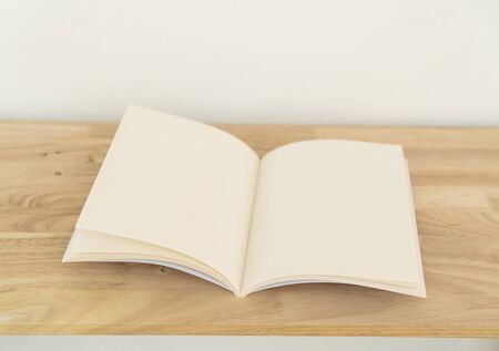 Blank catalog, magazines, book, mock up on wood background.の写真素材