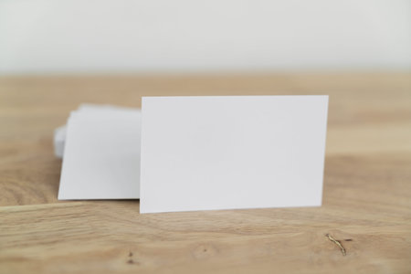 Blank business cards mock up on wooden surface.の写真素材