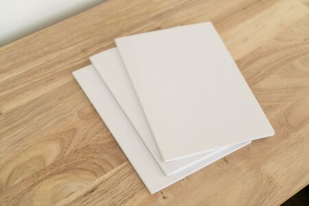 Blank catalog, magazines, book, mock up on wood background.の写真素材