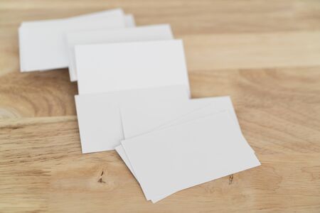 Blank business cards mock up on wooden surface.の写真素材