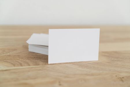 Blank business cards mock up on wooden surface.の写真素材