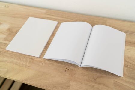 Blank catalog, magazines, book, mock up on wood background.の写真素材