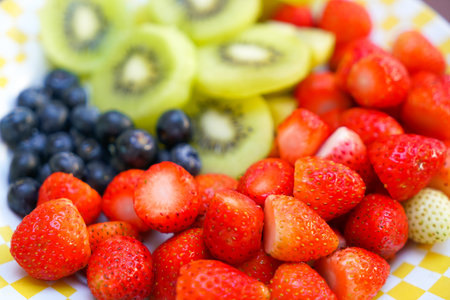healthy fresh fruit (strawberry, raspberry, blueberry, kiwi).
