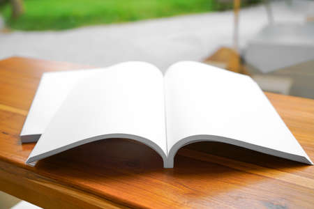 Blank catalog, magazines, book, mock up on wooden background. Mock up for design.の写真素材