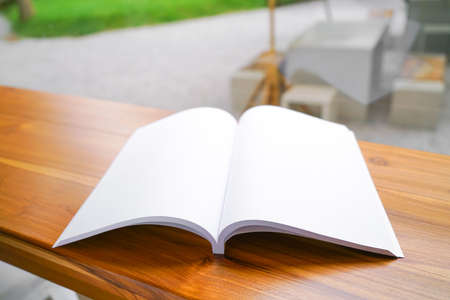 Blank catalog, magazines, book, mock up on wooden background. Mock up for design.の写真素材