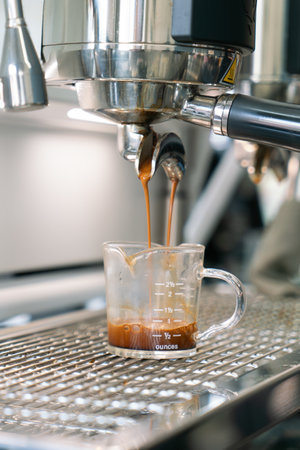 Preparing coffee in coffee shop with professional coffee machineの写真素材