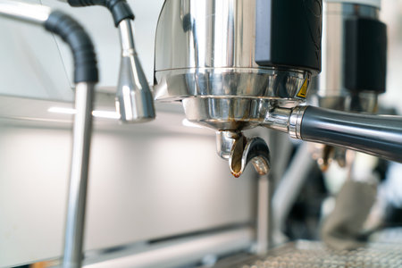 Preparing coffee in coffee shop with professional coffee machineの写真素材