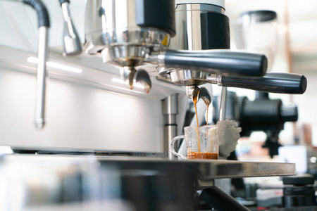 Preparing coffee in coffee shop with professional coffee machineの写真素材
