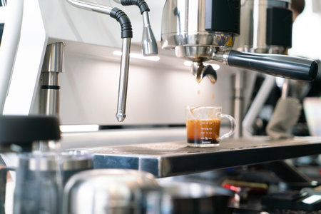 Preparing coffee in coffee shop with professional coffee machineの写真素材