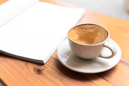 Empty coffee cup on wooden table background.の写真素材