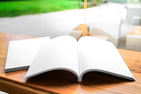 Blank catalog, magazines, book, mock up on wooden background. Mock up for design.の写真素材