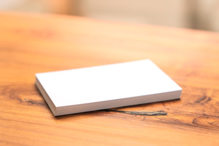 Blank mock up (business card) on wooden background. Mock up for design.の写真素材