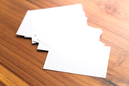 Blank mock up (business card) on wooden background. Mock up for design.の写真素材